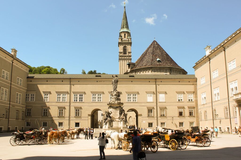 large square with fountain and horse and buggy