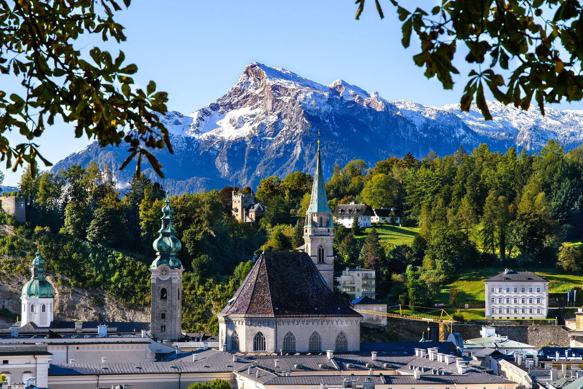 mountain with alpine town with church steeple