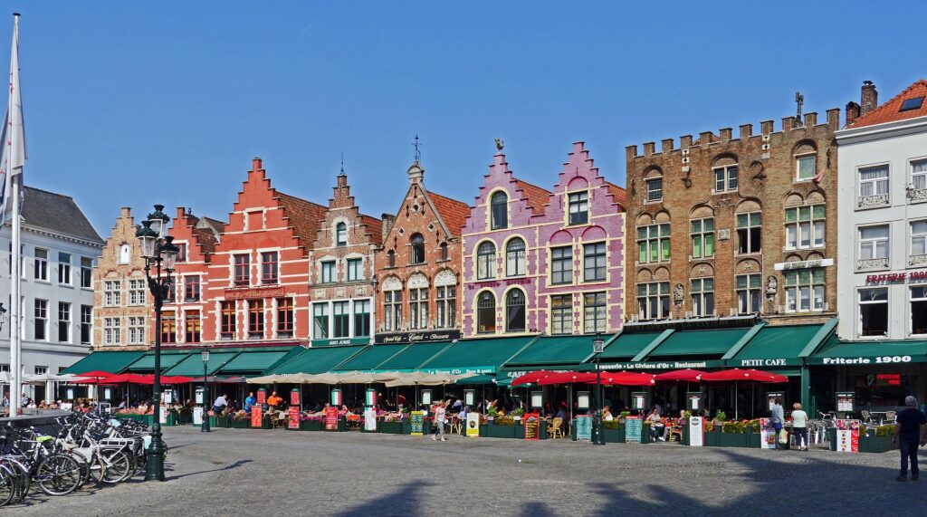 colourful row of buildings on market square belgium unesco