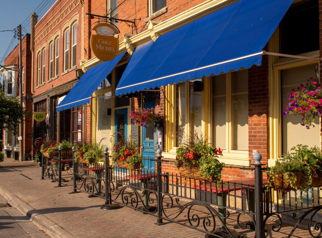 red brick restaurant with blue awning in Creemore