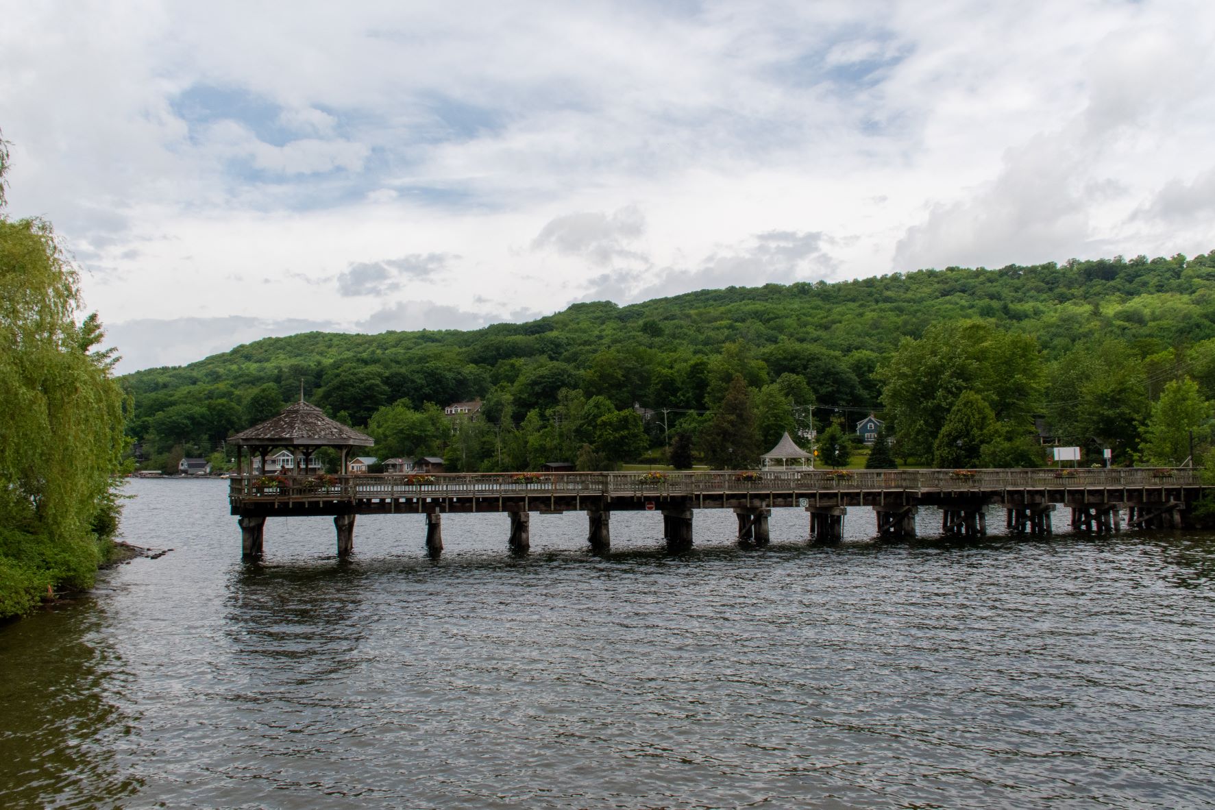 river with long dock and gazebo in North Hatley, Eastern Townships in Quebec.