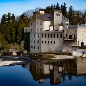 old mill limestone building on water