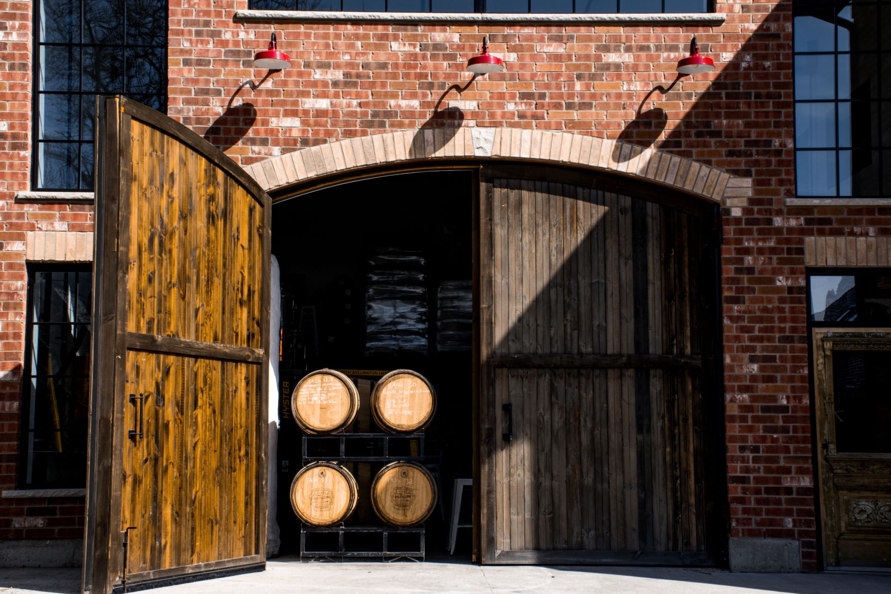 red building with liquor barrels stacked