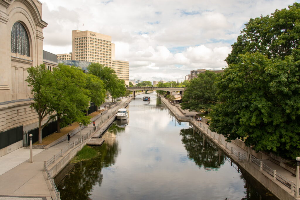 canal with trees and building at things to do in ottawa