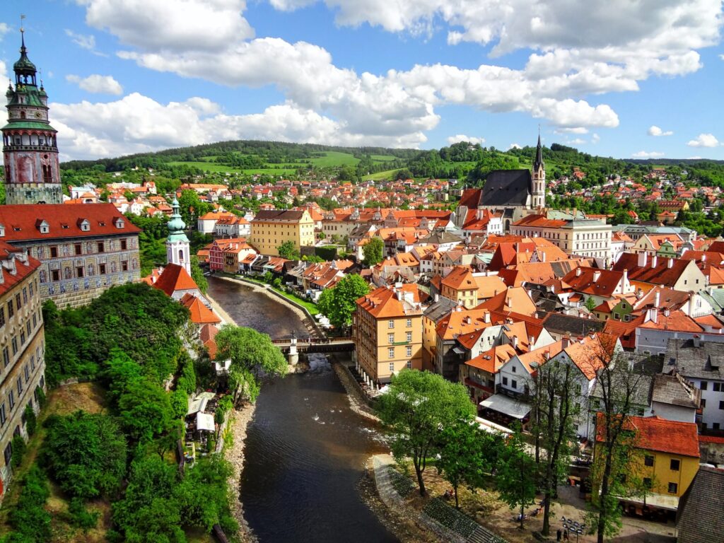 red rooftops and church steeple in cesky krumlov itinerary
