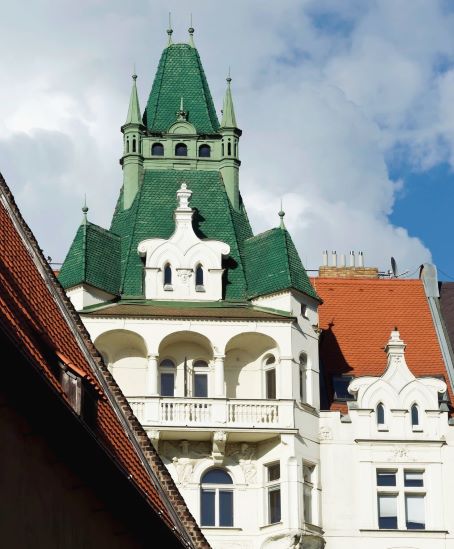 white building with green rooftop in Prague's Jewish Quarter