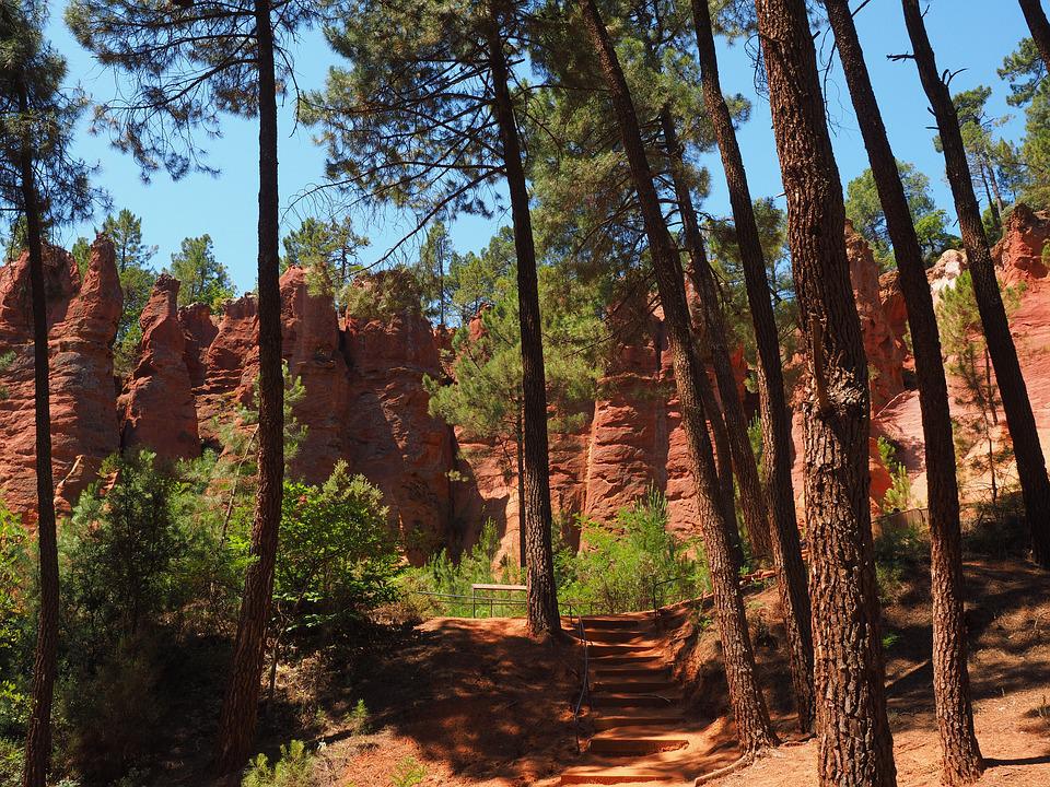 red ochre cliffs with trees found in Roussillon in le luberon provence