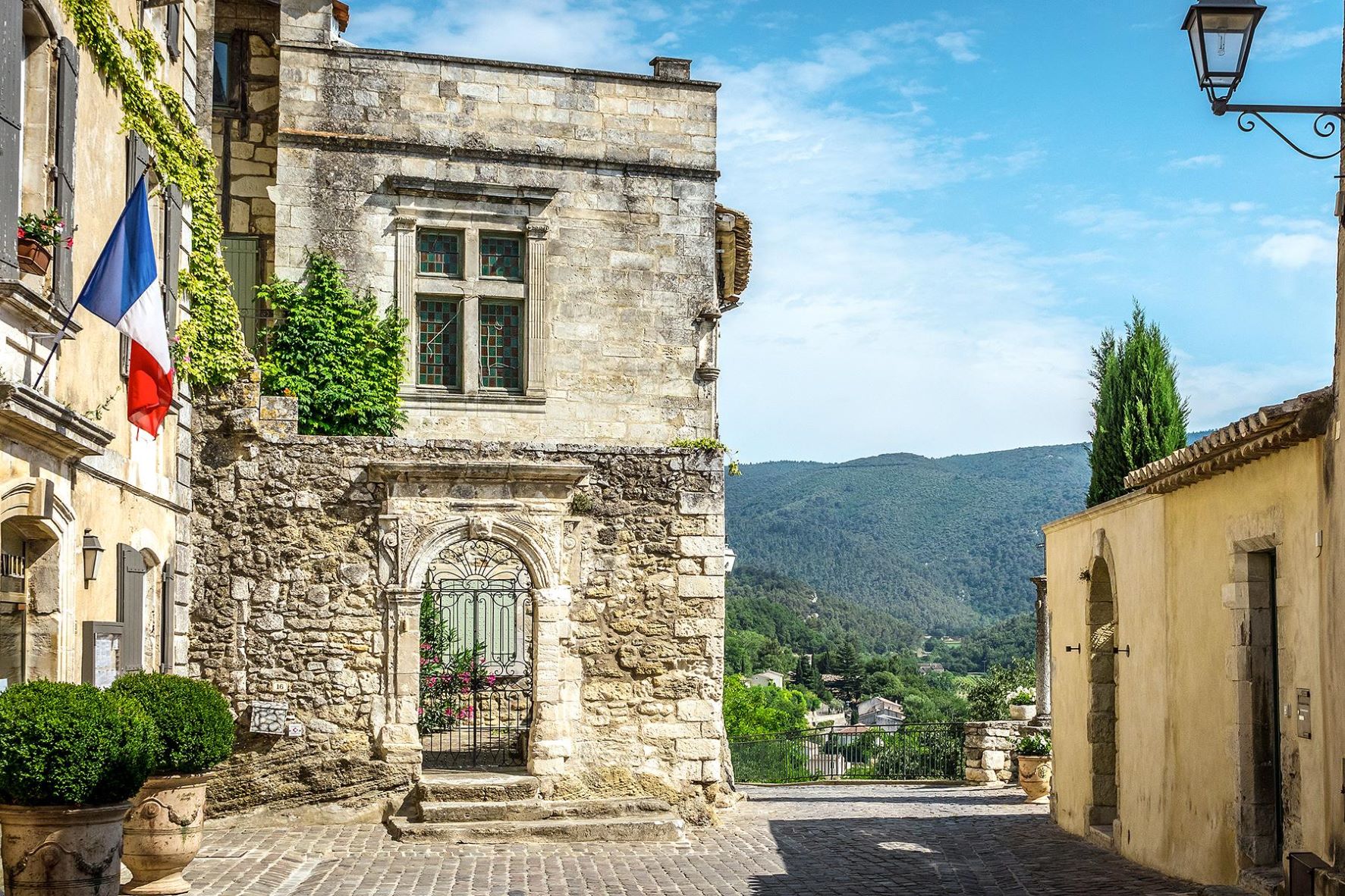 Menerbes, hilltop village made of stone with views of Luberon countryside in the heart of Provence