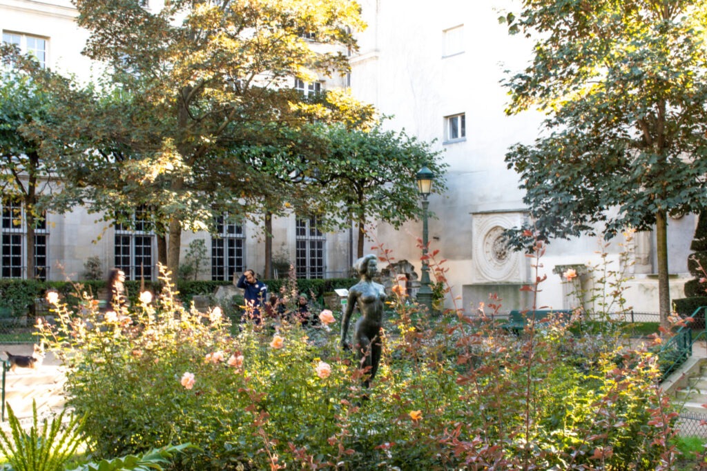 statue, rose garden in pretty parks in hidden gardens in paris