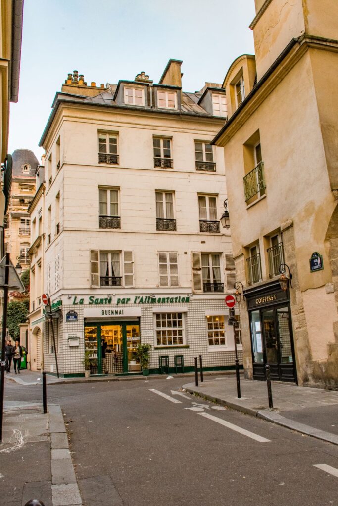 Things to Do in the 6th Arrondissement of Paris 2 Tall buildings on narrow street in 6th arr Paris