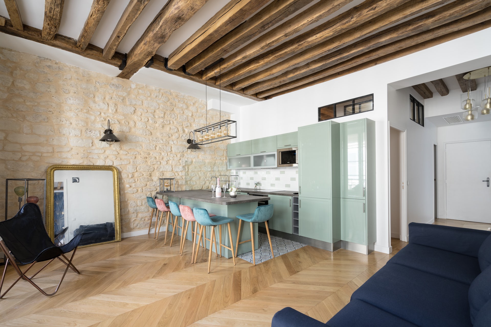apartment with stone wall and kitchen