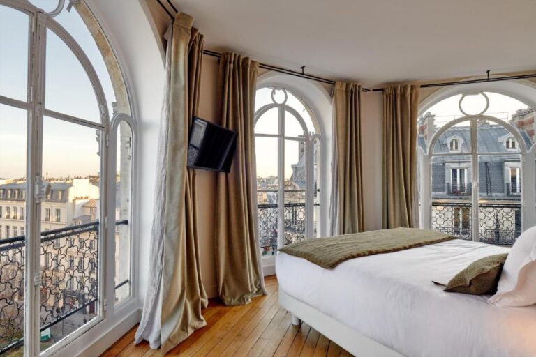 paris hotel room with views of Paris buildings