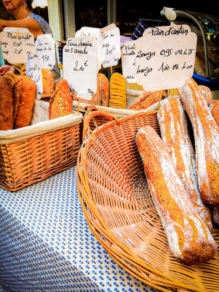 bread loaves, baguettes in market stall