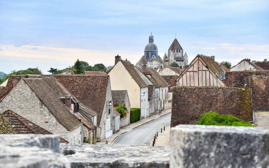 medieval town with buildings and road listed as UNESCO heritage sites in France
