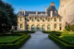 palace in marais paris with gardens and pathway