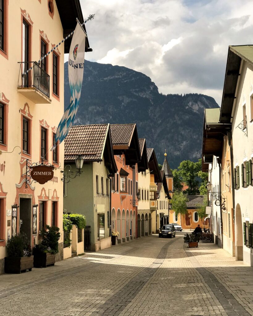 alpine town with colourful buildings and mountain