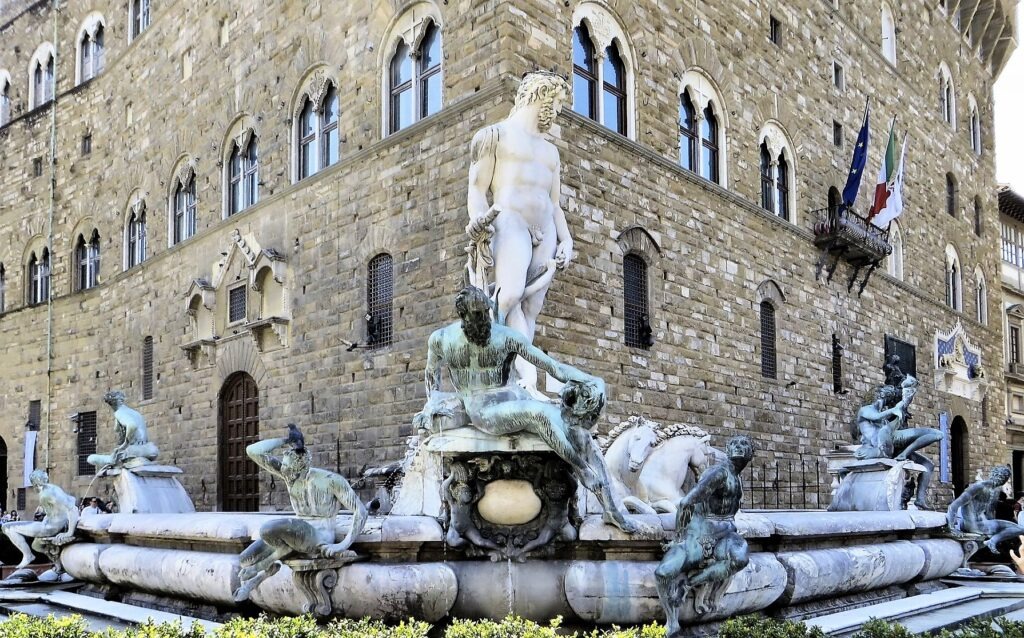 stone statue of man in fountain in florence