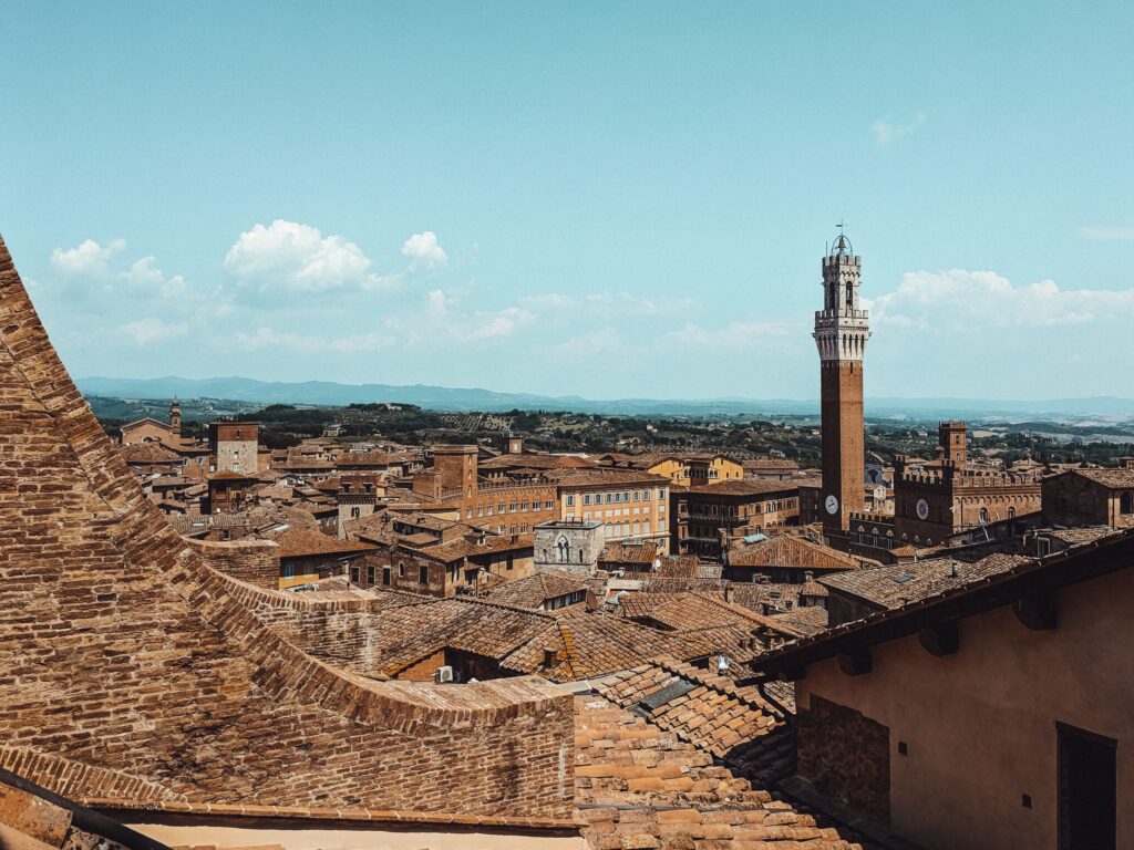 city rooftop view of Siena with tower