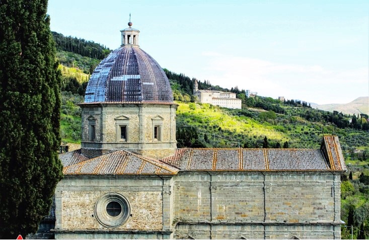 church with round cuppla on hillside in cortona