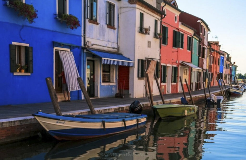 colourful buildings, canal and boats in venice 