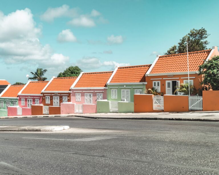 pastel colour houses with clay tile roofs