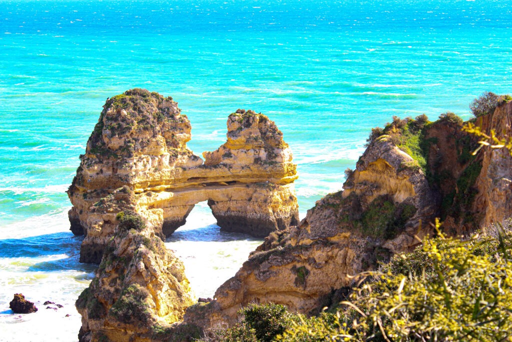 blue water and cliffs on beaches in algarve