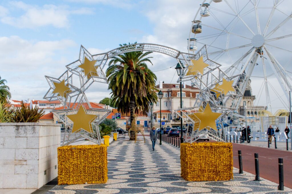 ferris wheel and decorations at christmas market in portugal