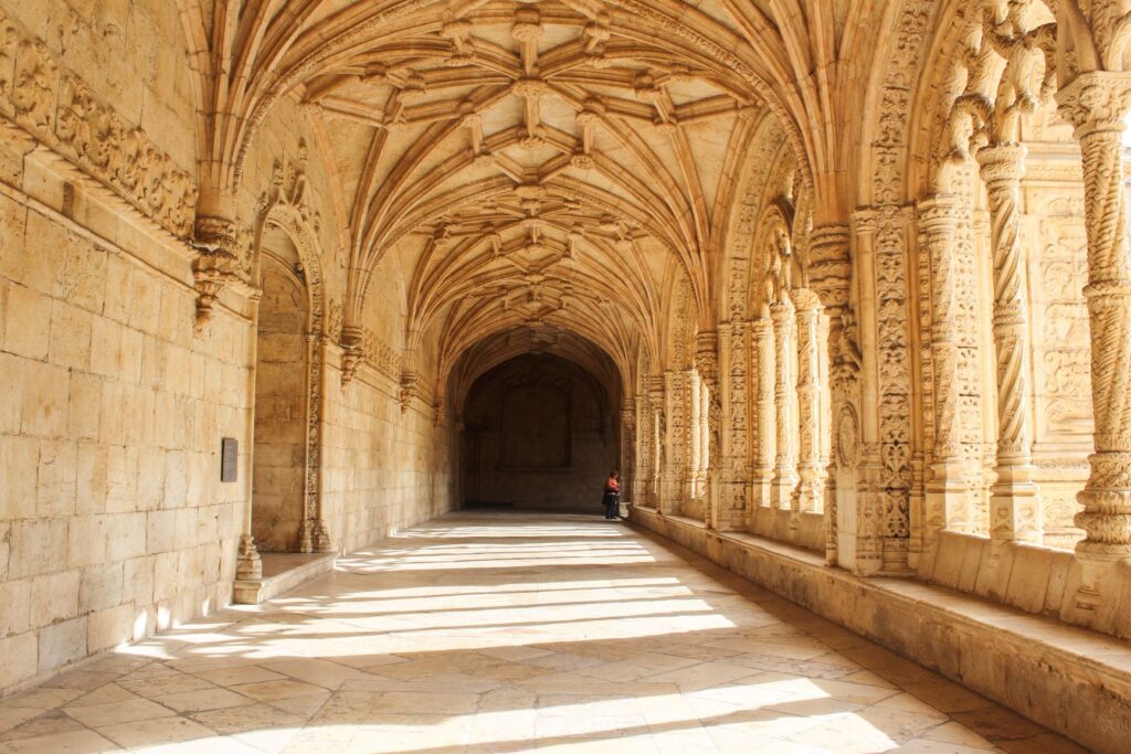 Jerónimos Monastery Lisbon with archway with light creating shadows