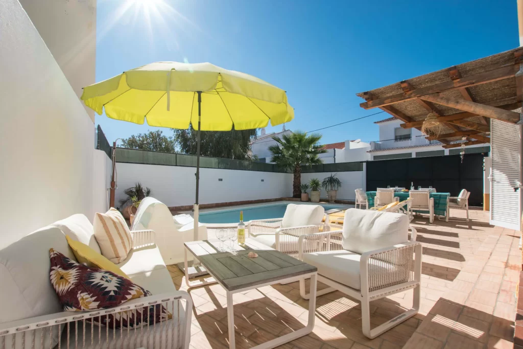 pool, patio, sun umbrella in things to do in tavira