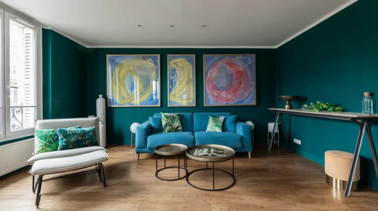 teal walls with large artwork