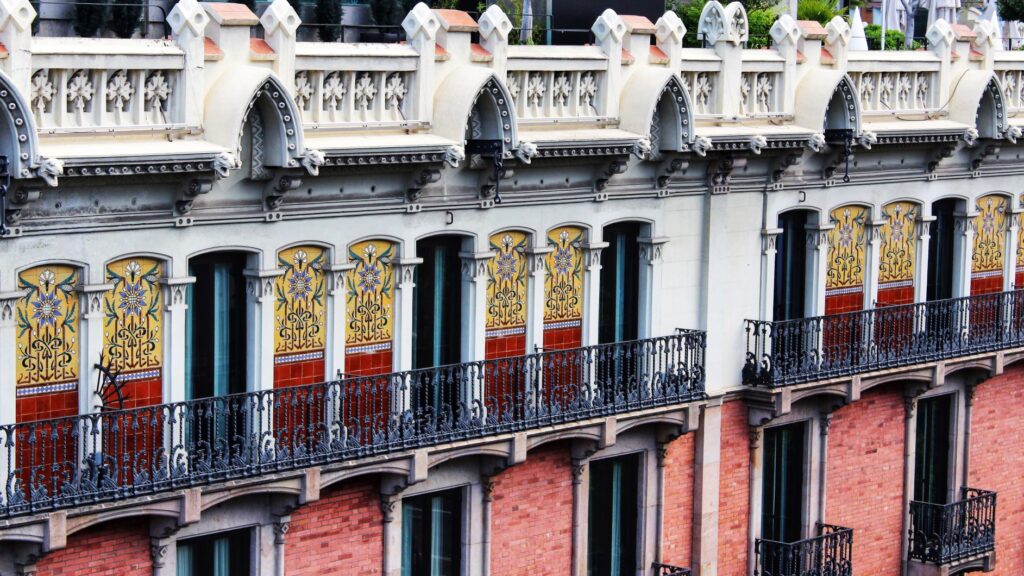 architecture in barcelona's old city with iron balconies and tiles