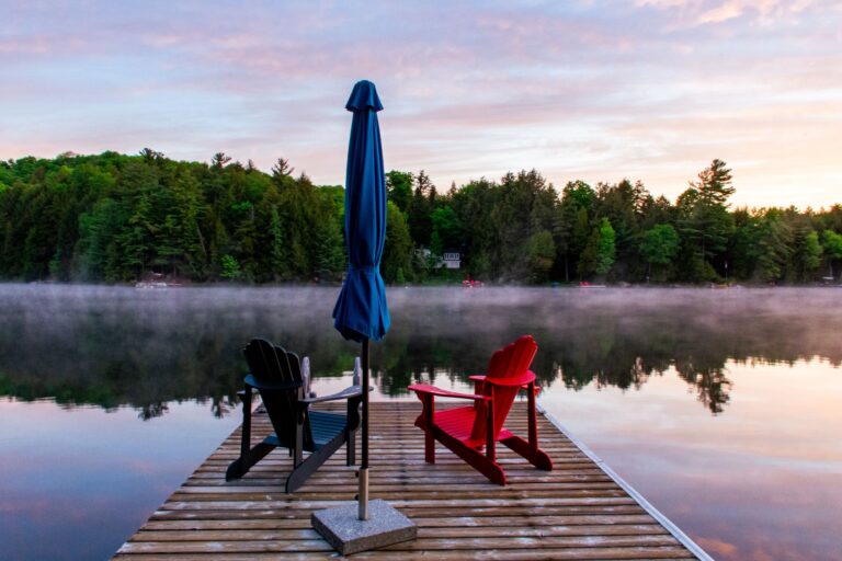 dock at sunrise with 2 Adirondack chairs