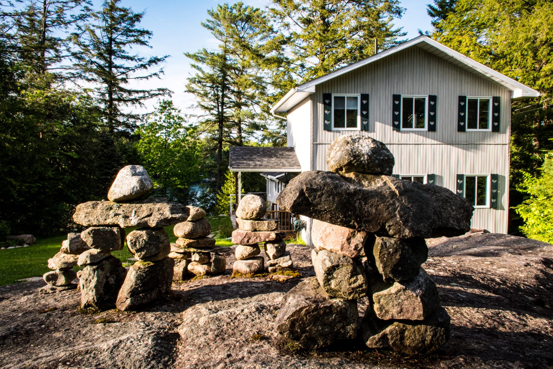 gray cottage with rocks
