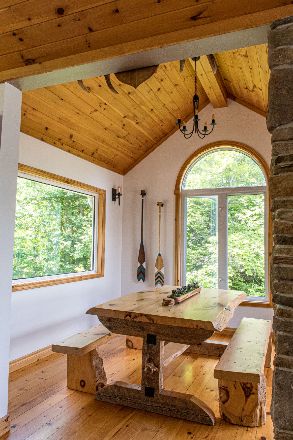 vaulted ceiling with live edge wooden table