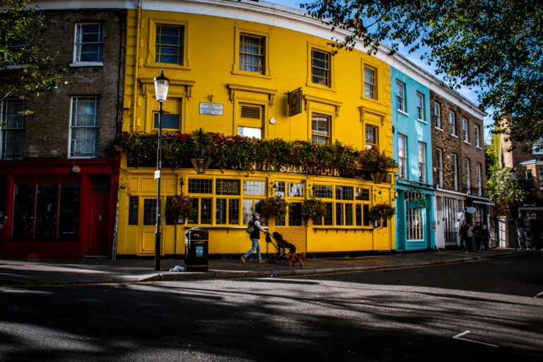 yellow building with flower boxes in London UK