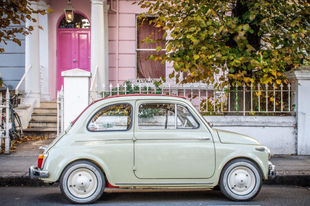 cute car with pink house in notting hill
