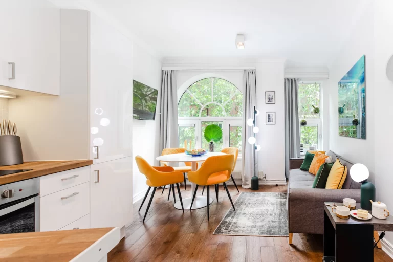 living space with orange chairs