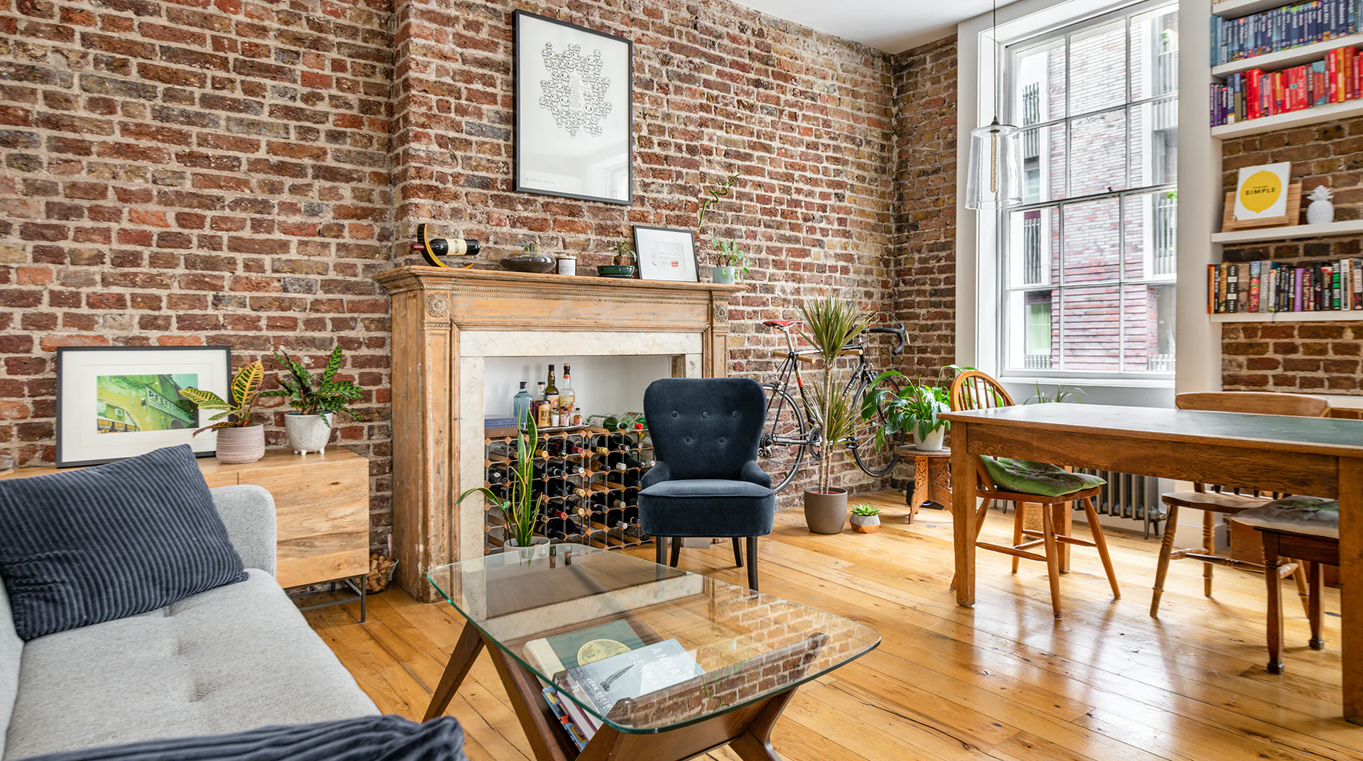 brick wall with fireplace and windows