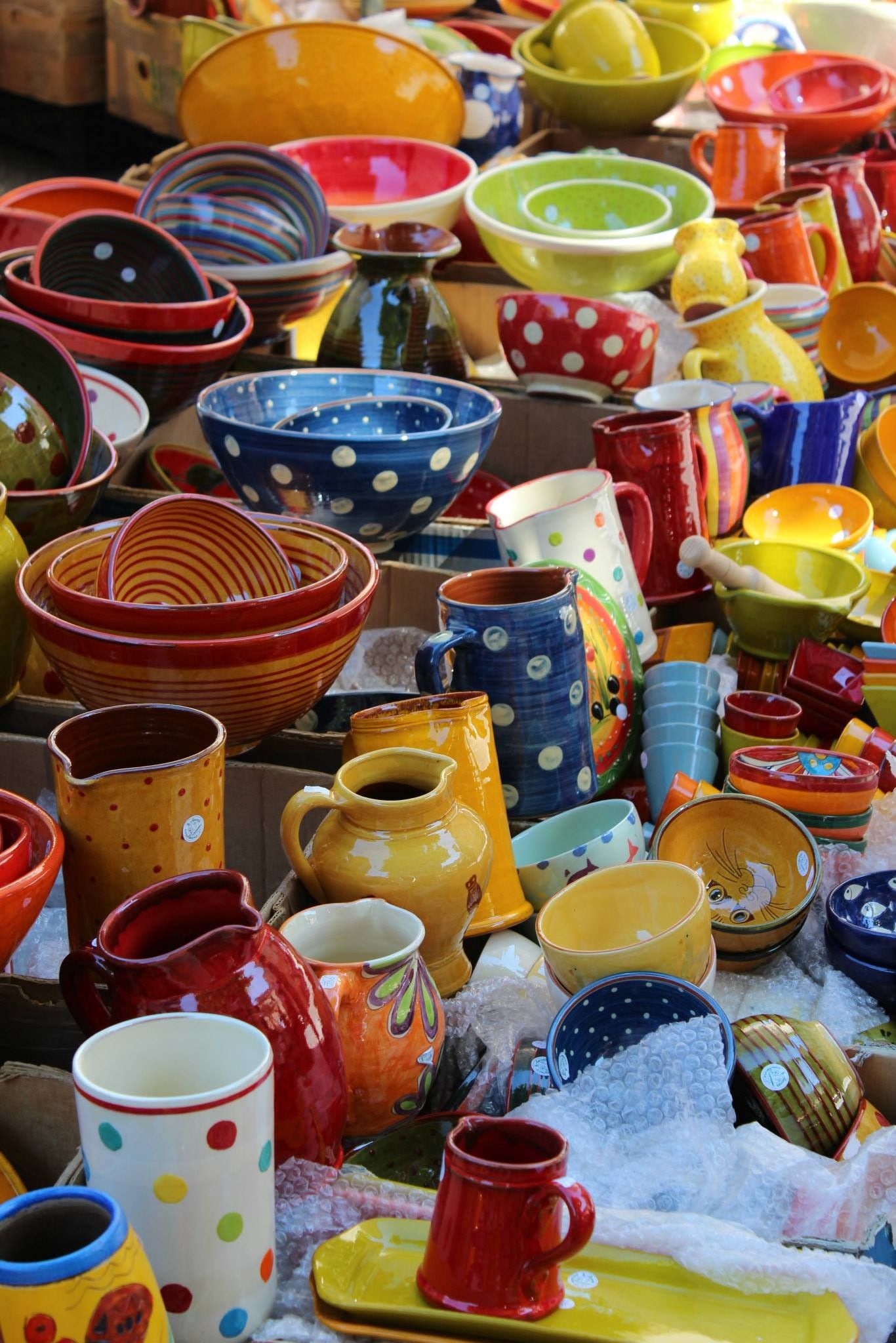 multi-colour ceramics in market stall
