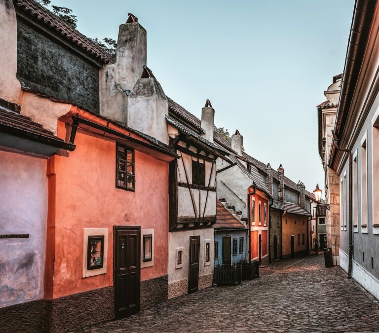 coloured houses on cobbled stone street in Prague
